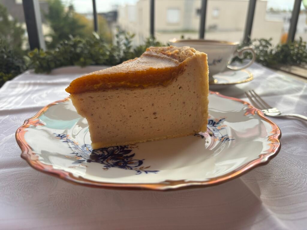 Pumpkin Flan Slice on Vintage Plate Exterior